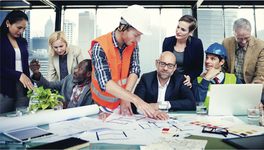 Group of workers collaborate