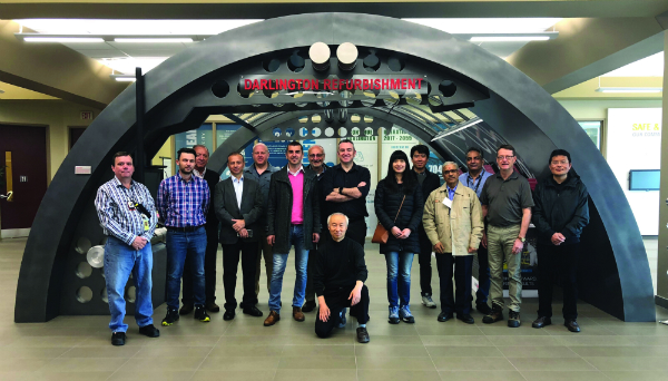 Group of people pose at Darlington Refurbishment site